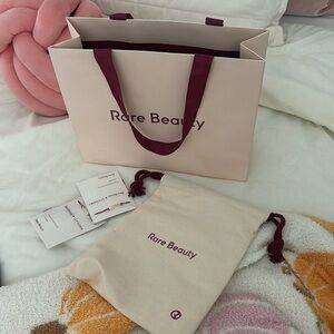 Rare beauty bag, dust bag, & two bracelets